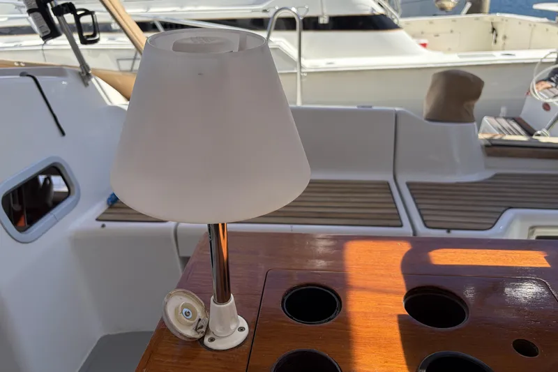 Slide: The Image of Lamp on Beneteau Oceanis 37 yacht's wooden deck, 2010 model, with cup holders. - 37
