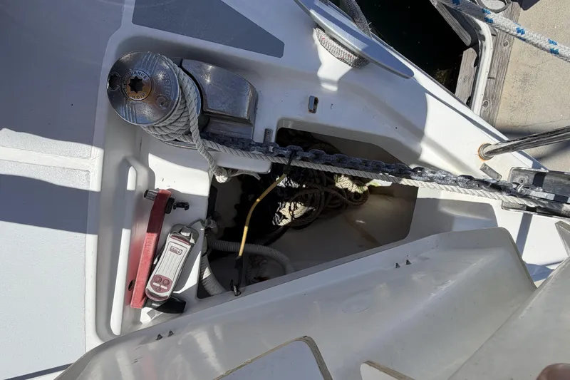 Slide: The Image of Anchor locker and winch on a 2010 Beneteau Oceanis 37 sailboat deck. - 4