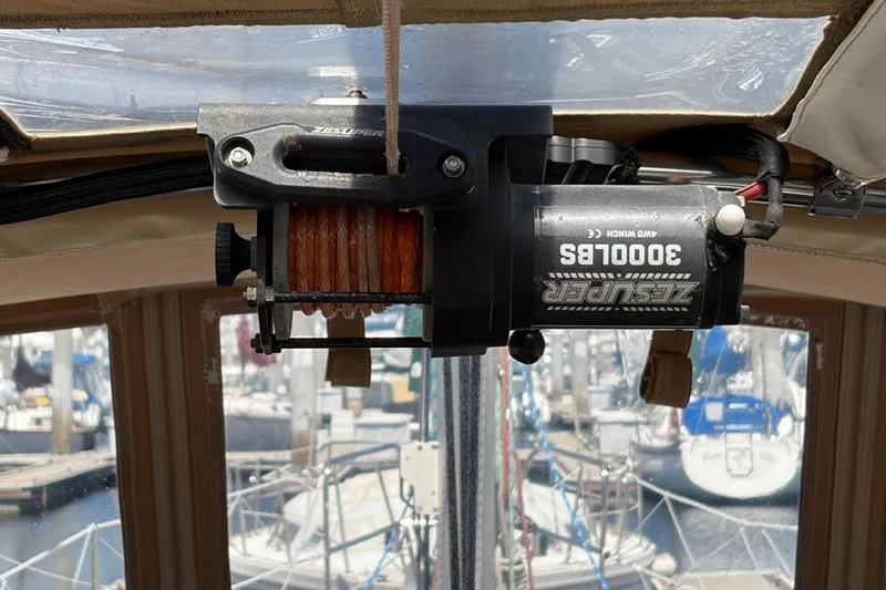 Slide: The Image of Electric winch on a 2010 Beneteau Oceanis 37 sailboat, docked at a marina. - 40