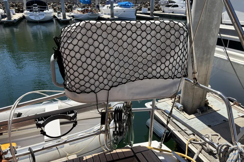 Slide: The Image of Beneteau Oceanis 37 sailboat helm with protective cover, docked at marina, 2010 model. - 41