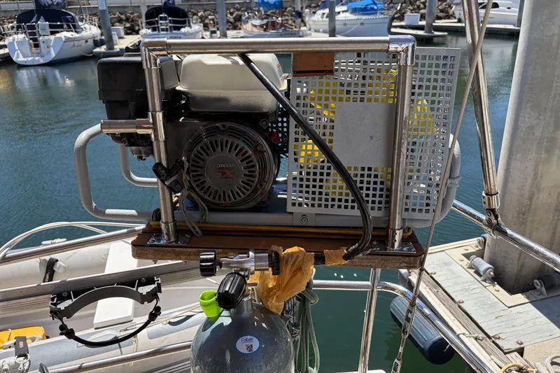 Slide: The Image of Portable compressor on a 2010 Beneteau Oceanis 37 sailboat at a marina. - 43