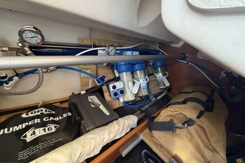 Slide: The Image of Storage compartment of a 2010 Beneteau Oceanis 37 with water filtration system. - 48