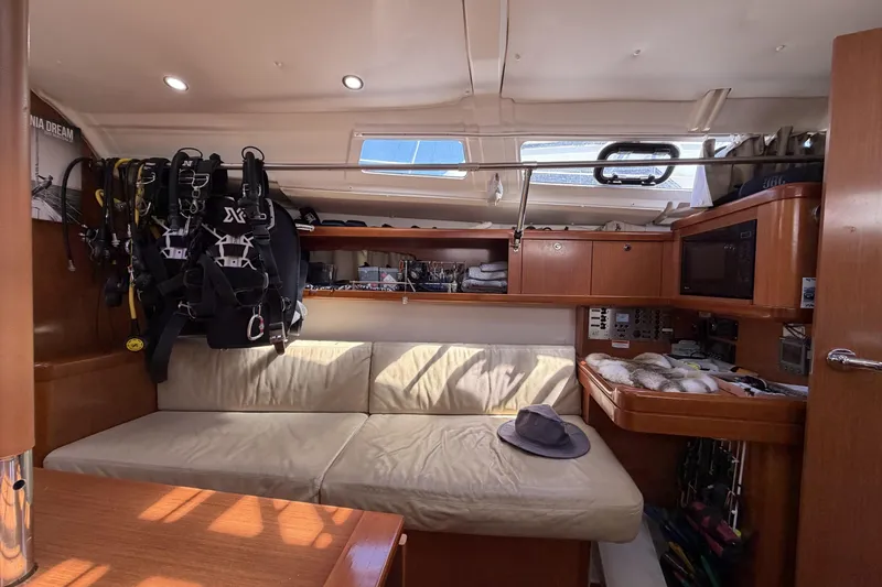 Slide: The Image of Interior of a 2010 Beneteau Oceanis 37 sailboat with cozy seating and equipment. - 54