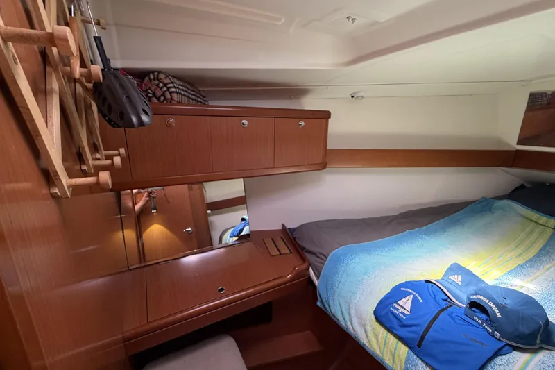 Slide: The Image of Cozy cabin interior of 2010 Beneteau Oceanis 37 sailboat with wooden furnishings. - 71