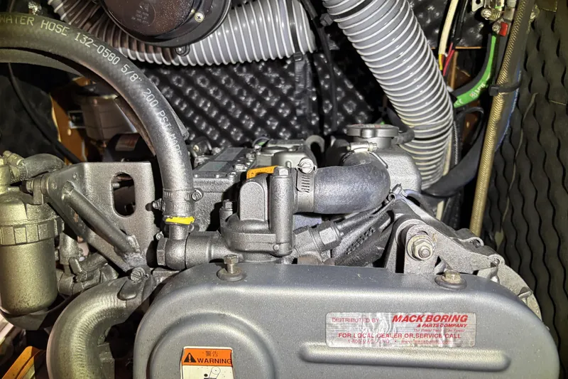 Slide: The Image of Engine compartment of a 2010 Beneteau Oceanis 37 sailboat, showcasing detailed mechanical components. - 81