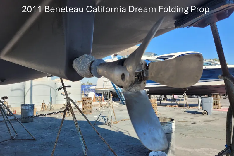 Slide: The Image of 2011 Beneteau Oceanis 37 with California Dream folding propeller in a boatyard setting. - 89