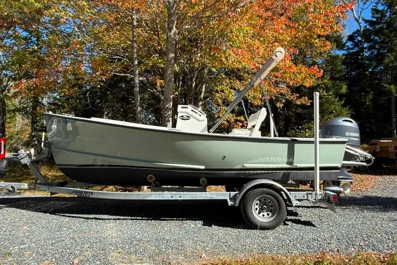 The Image of 2023 Seaway 18 Sportsman boat on trailer, surrounded by autumn trees. - 0