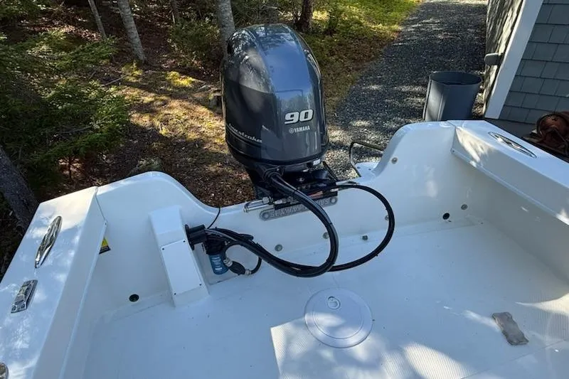 Slide: The Image of 2023 Seaway 18 Sportsman boat with Yamaha 90 outboard motor in wooded area. - 4