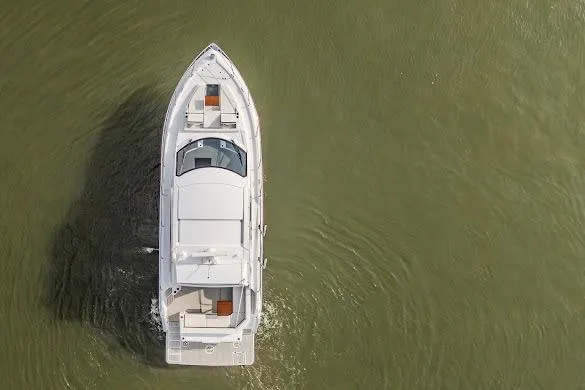 Slide: The Image of 2023 Cruisers Yachts 42 Cantius cruising on calm water, aerial view. - 21