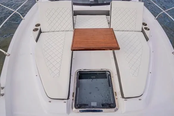 Slide: The Image of Luxurious seating area on 2023 Cruisers Yachts 42 Cantius with elegant table and cushions. - 36