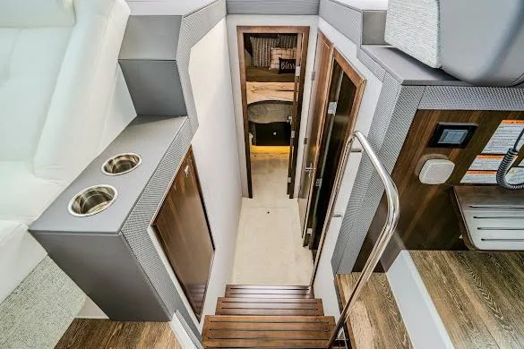 Slide: The Image of Interior view of 2023 Cruisers Yachts 42 Cantius, featuring modern stairs and sleek design. - 46