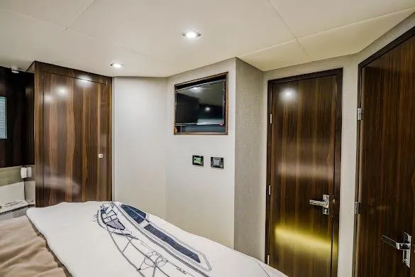 Slide: The Image of Luxurious interior of 2023 Cruisers Yachts 42 Cantius with modern wood finishes. - 48