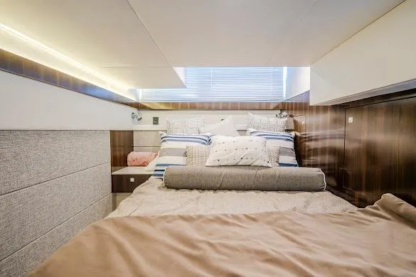Slide: The Image of Luxurious bedroom interior of 2023 Cruisers Yachts 42 Cantius with modern design and cozy bedding. - 53