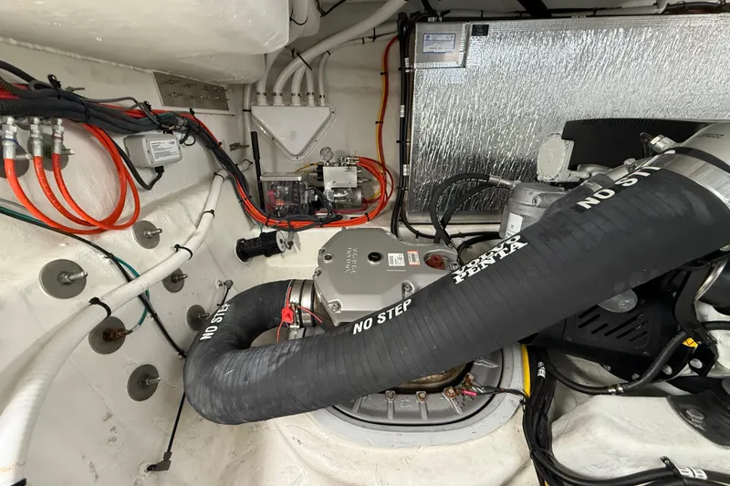 Slide: The Image of Engine room of 2023 Cruisers Yachts 42 Cantius, featuring Volvo Penta components and wiring. - 59