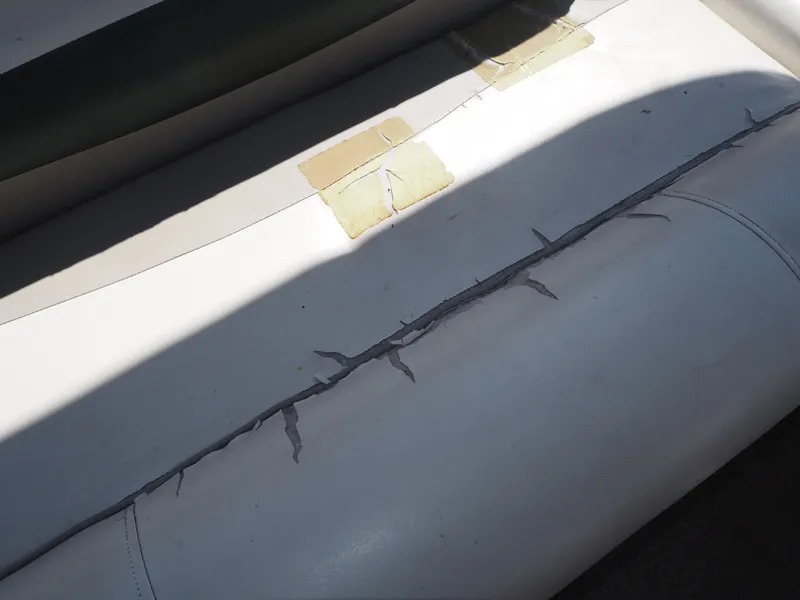 Slide: The Image of Torn seat upholstery on a 2005 Harris Sunliner 200. - 16