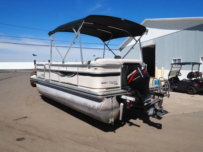 Slide: The Image of 2005 Harris Sunliner 200 pontoon boat with canopy and outboard motor. - 4
