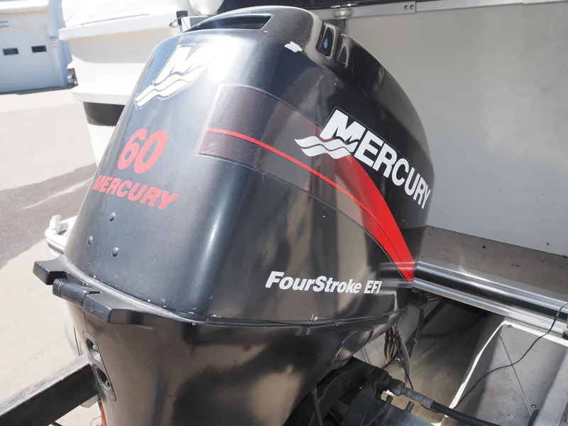 Slide: The Image of Mercury 60 HP outboard motor on a 2005 Harris Sunliner 200. - 7
