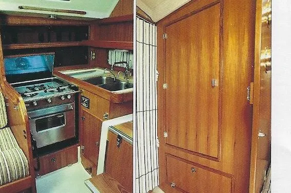 Slide: The Image of 1981 Yamaha 36 yacht interior with wooden cabinetry, stove, and sink. - 3