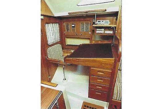 Slide: The Image of 1981 Yamaha 36 yacht interior with navigation station and wooden cabinetry. - 4