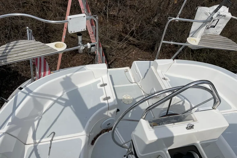Slide: The Image of Cockpit of a 1995 Hunter 336 sailboat with steering wheel and seating area. - 7