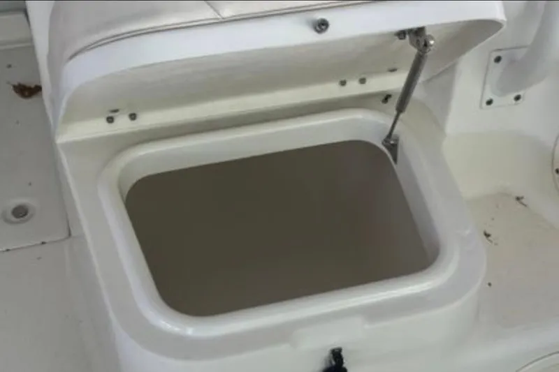 Slide: The Image of Open storage compartment on a 2017 Robalo R265 Walkaround boat. - 24