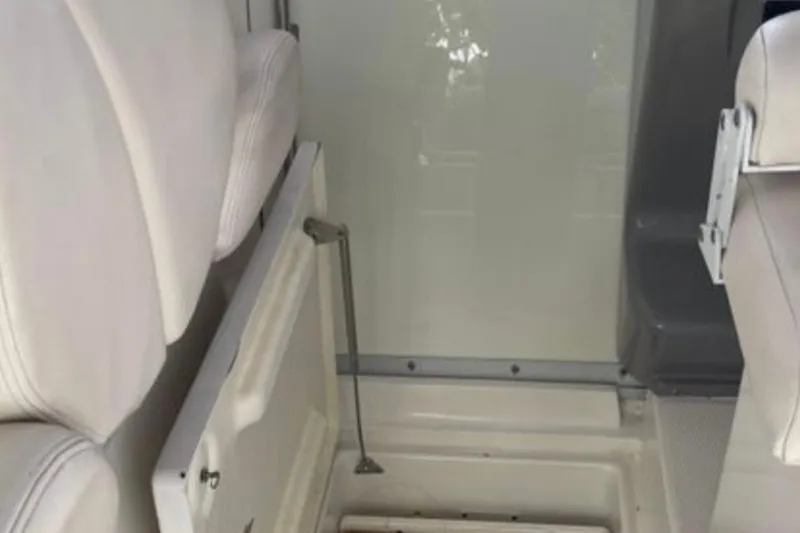 Slide: The Image of 2017 Robalo R265 Walkaround interior seating and storage compartment detail. - 31