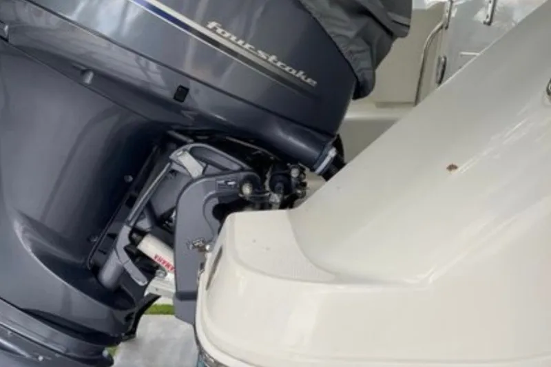 Slide: The Image of 2017 Robalo R265 Walkaround boat engine close-up, featuring a four-stroke motor. - 37