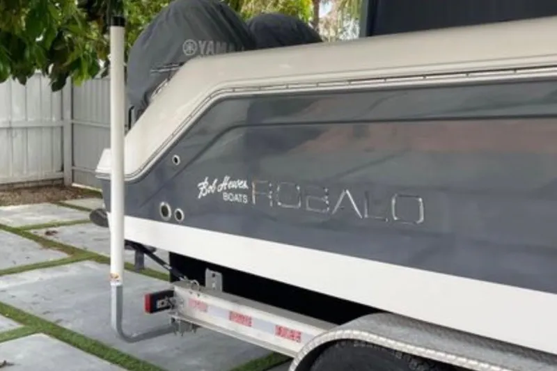 Slide: The Image of 2017 Robalo R265 Walkaround boat on trailer, side view. - 17