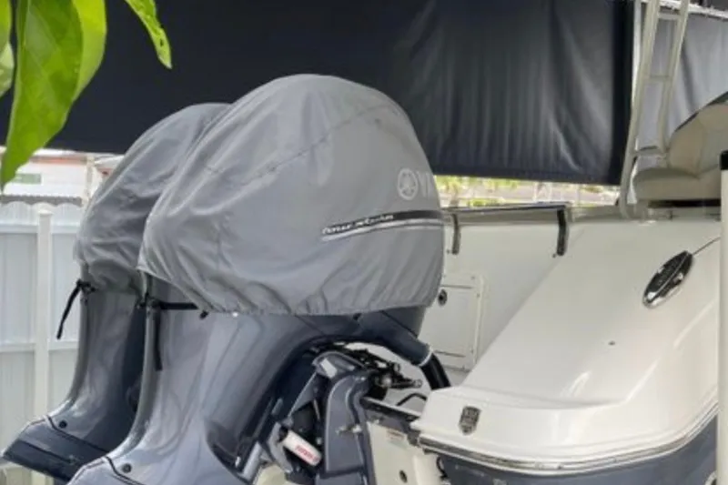 Slide: The Image of 2017 Robalo R265 Walkaround boat with covered outboard motors. - 19