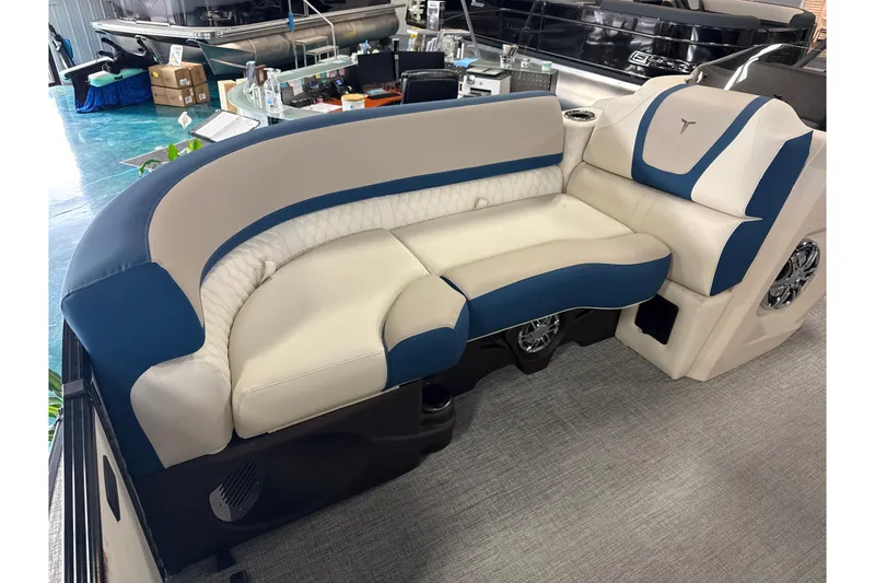 Slide: The Image of 2026 Tahoe Pontoon Cascade VRL 23' interior seating with blue and beige upholstery. - 11