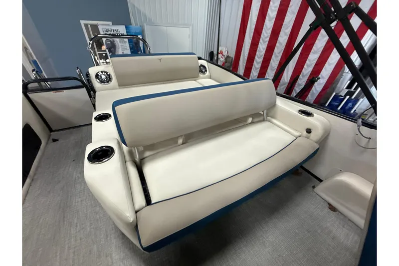 Slide: The Image of 2026 Tahoe Pontoon Cascade VRL 23' interior with beige seating and cup holders. - 2