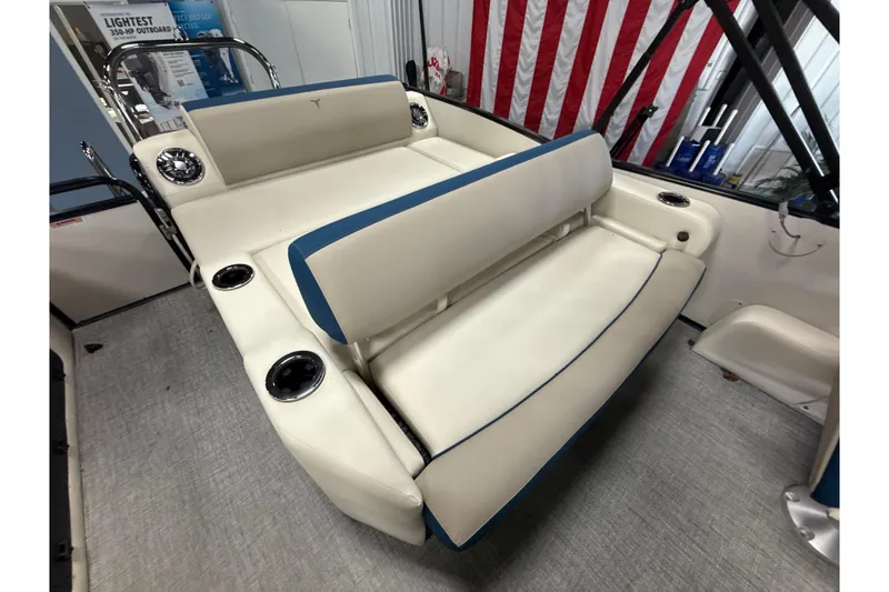 Slide: The Image of 2026 Tahoe Pontoon Cascade VRL - 23' interior seating with cup holders and American flag backdrop. - 3