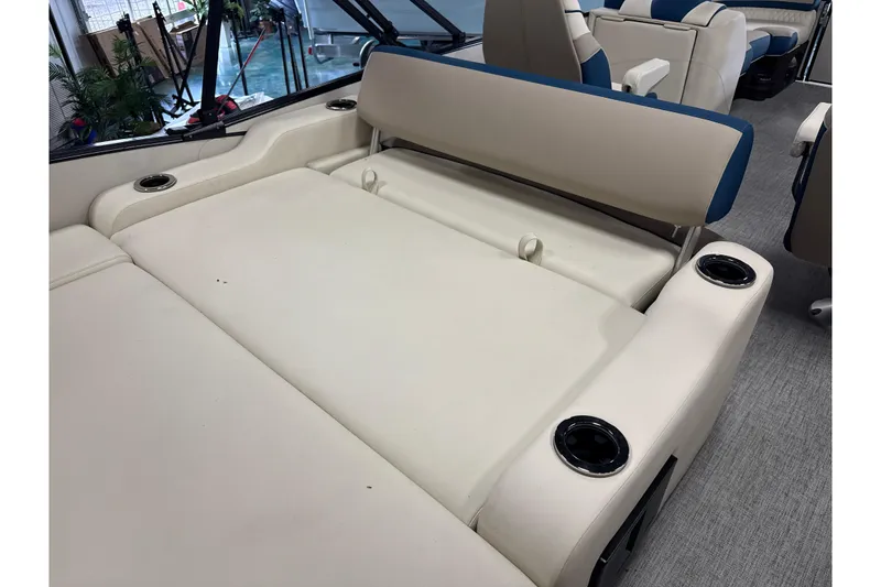 Slide: The Image of 2026 Tahoe Pontoon Cascade VRL interior seating with cup holders and beige upholstery. - 4