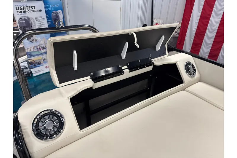Slide: The Image of 2026 Tahoe Pontoon Cascade VRL 23' boat interior storage compartment with speakers. - 5