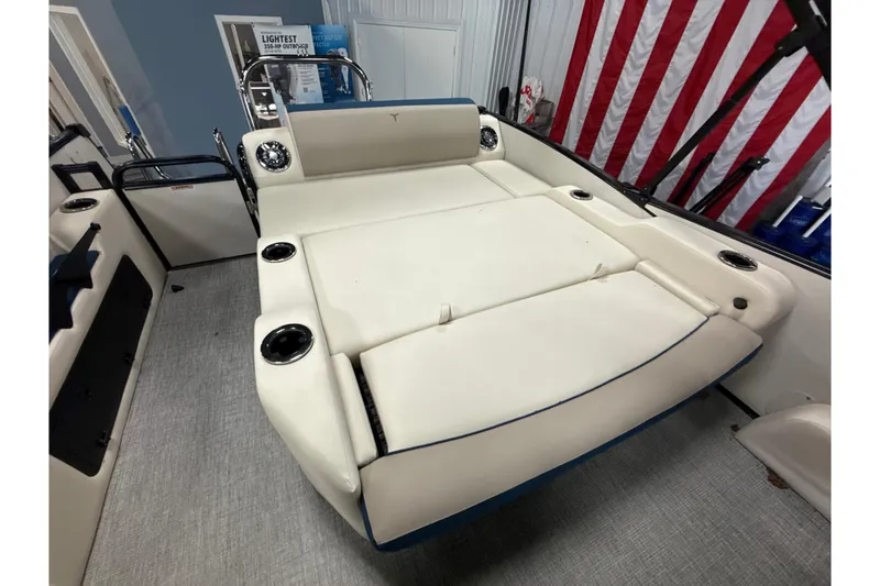 Slide: The Image of 2026 Tahoe Pontoon Cascade VRL 23' interior with beige seating and cup holders. - 6