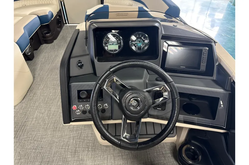 Slide: The Image of 2026 Tahoe Pontoon Cascade VRL 23' dashboard with steering wheel and control panel. - 7