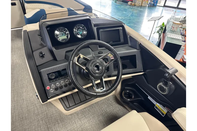 Slide: The Image of 2026 Tahoe Pontoon Cascade VRL 23' dashboard with steering wheel and controls. - 8