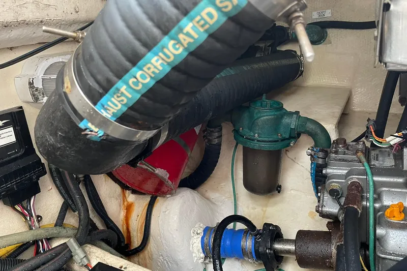 Slide: The Image of Engine compartment of a 2008 Luhrs 28 Open boat, showing exhaust and mechanical components. - 10