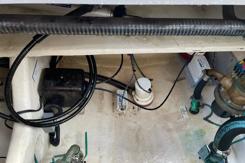 Slide: The Image of Engine compartment of a 2008 Luhrs 28 Open boat, showing wiring and mechanical components. - 13