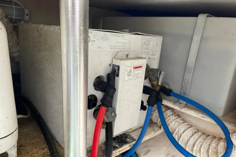 Slide: The Image of Electrical components and wiring inside a 2008 Luhrs 28 Open boat. - 14