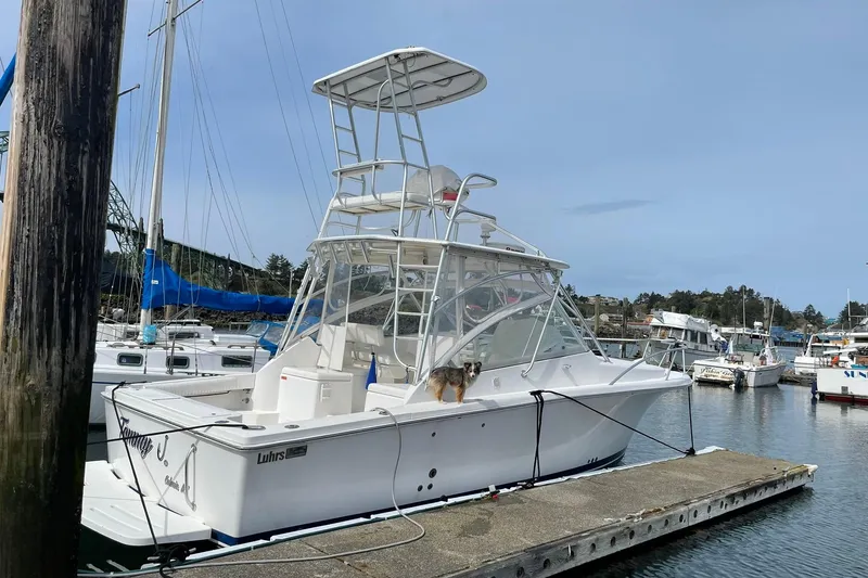 Slide: The Image of 2008 Luhrs 28 Open boat docked at marina with clear skies. - 17