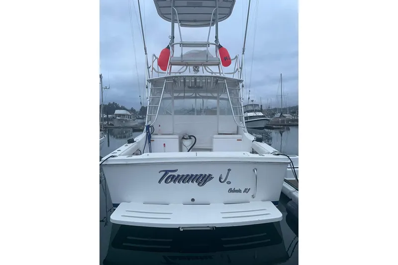 Slide: The Image of 2008 Luhrs 28 Open boat docked at marina, rear view with tower and equipment. - 20
