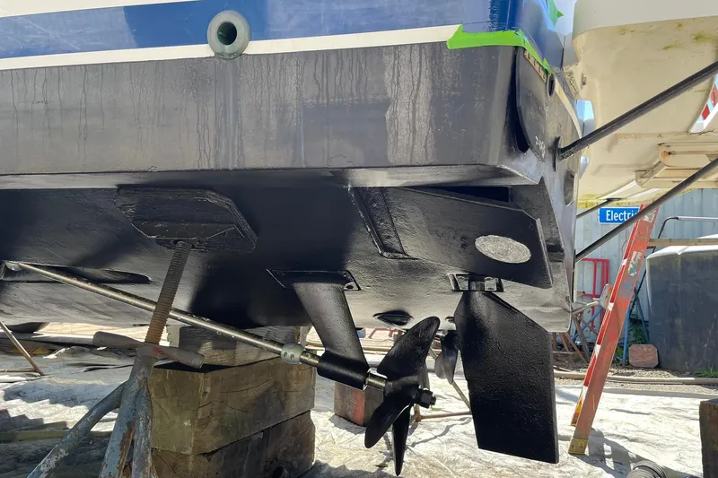Slide: The Image of 2008 Luhrs 28 Open boat hull and propeller during maintenance. - 21