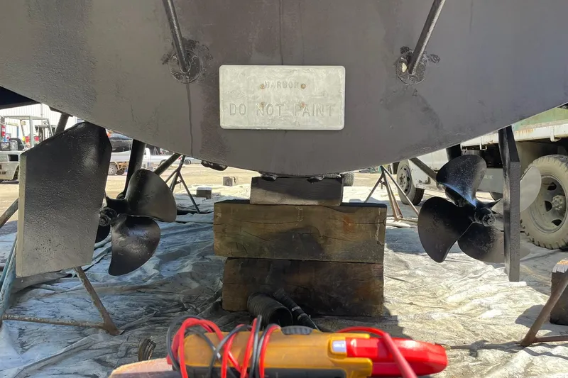Slide: The Image of 2008 Luhrs 28 Open boat underside with propellers and "Do Not Paint" sign. - 23