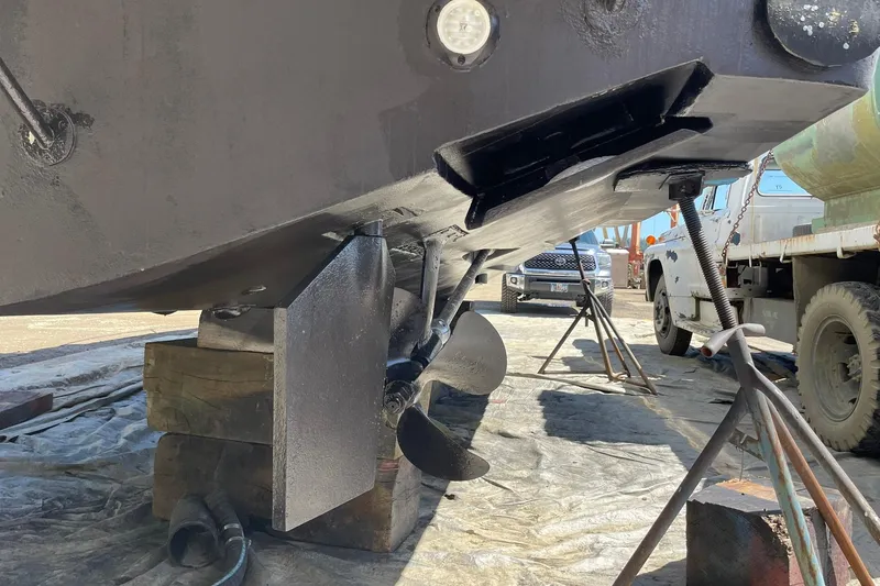 Slide: The Image of 2008 Luhrs 28 Open boat hull and propeller in dry dock maintenance. - 24