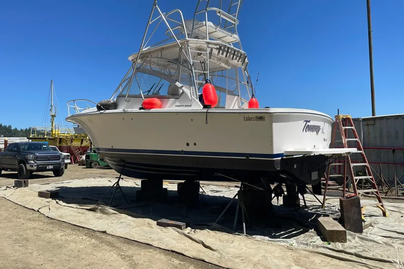 Slide: The Image of 2008 Luhrs 28 Open boat on dry dock with clear blue sky background. - 31