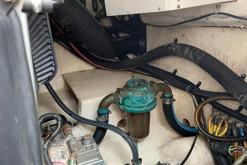 Slide: The Image of Engine compartment of a 2008 Luhrs 28 Open boat, showing hoses and wiring. - 9
