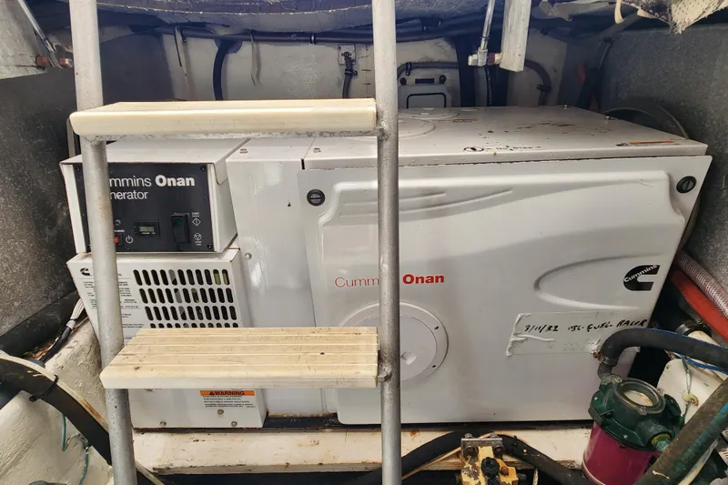 Slide: The Image of Cummins Onan generator in a 1995 Bertram 43 Convertible engine room. - 19