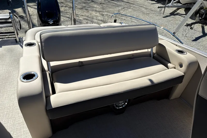 Slide: The Image of 2026 Tahoe Pontoon Cascade Versatile Rear Bench 23 with beige seating and cup holders. - 3