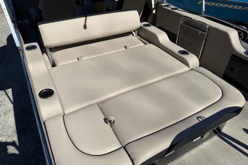 Slide: The Image of 2026 Tahoe Pontoon Cascade Versatile Rear Bench 23 with beige seating and cup holders. - 4